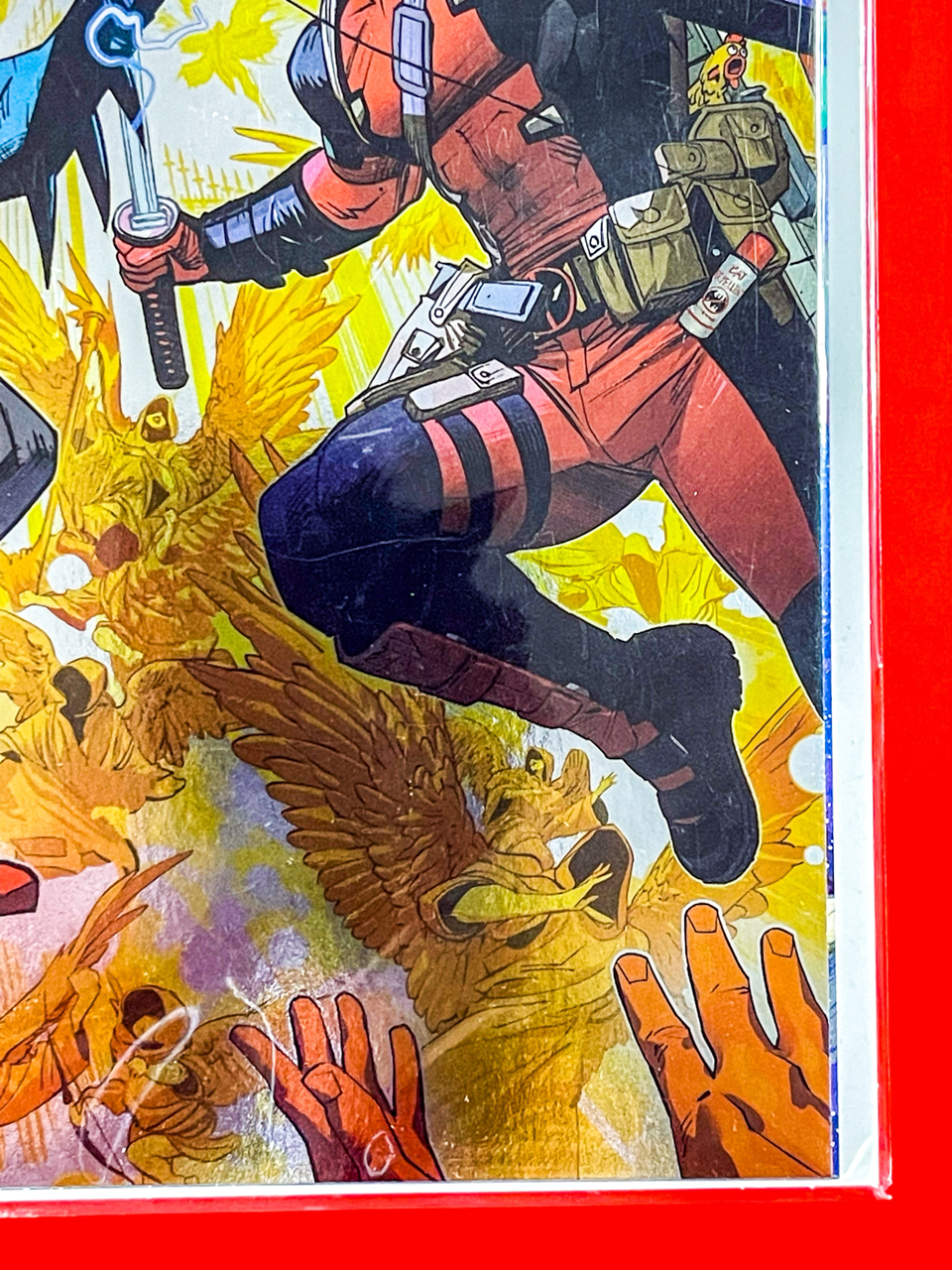 Bottom right corner of Batman & Deadpool #1 | Dan Mora Cover