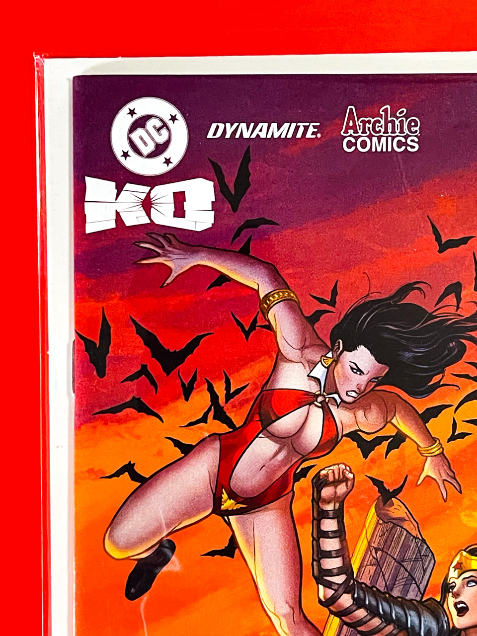 Top left corner of DC K.O Boss Battle #1 | Frank Cho & Sabine Rich Cover
