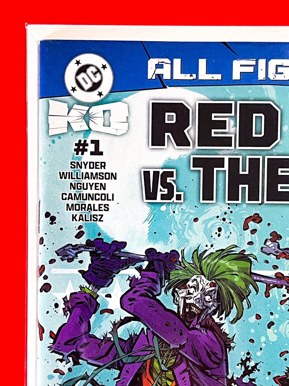 Top left corner of DC K.O: Red Hood vs The Joker #1 | Jorge Corona & Sarah Stern Cover