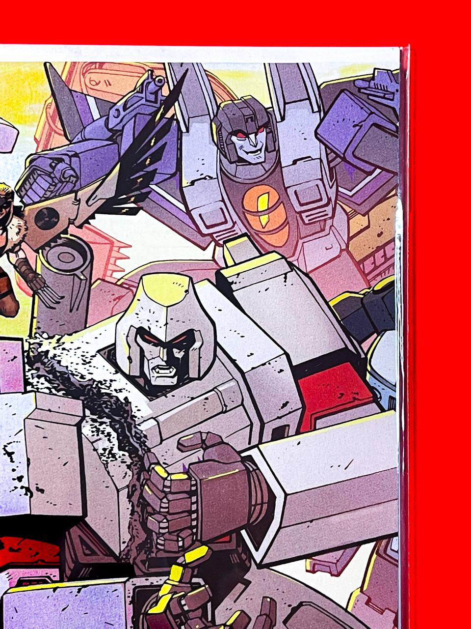 Top right corner of Transformers #33 | Tom Reilly & Adriano Lucas Cover