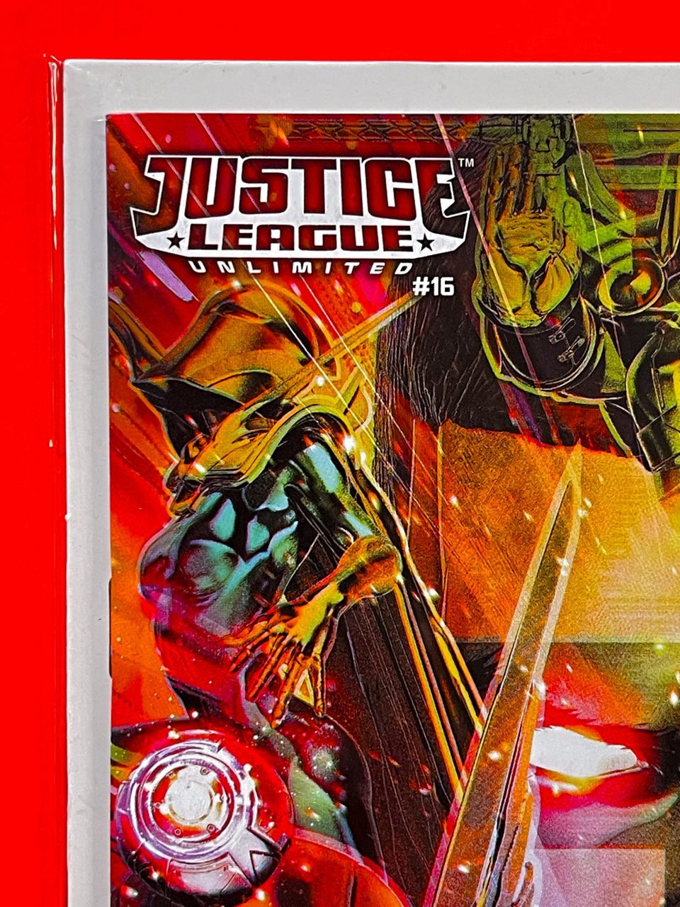 Top left corner of Justice League Unlimited #16 | John Giang Cover