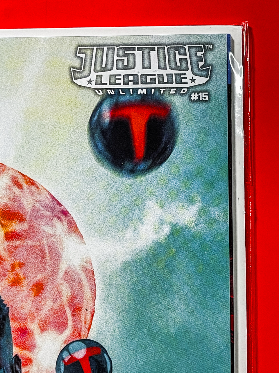 Top right corner of Justice League Unlimited #15 | Kevin Wada Cover