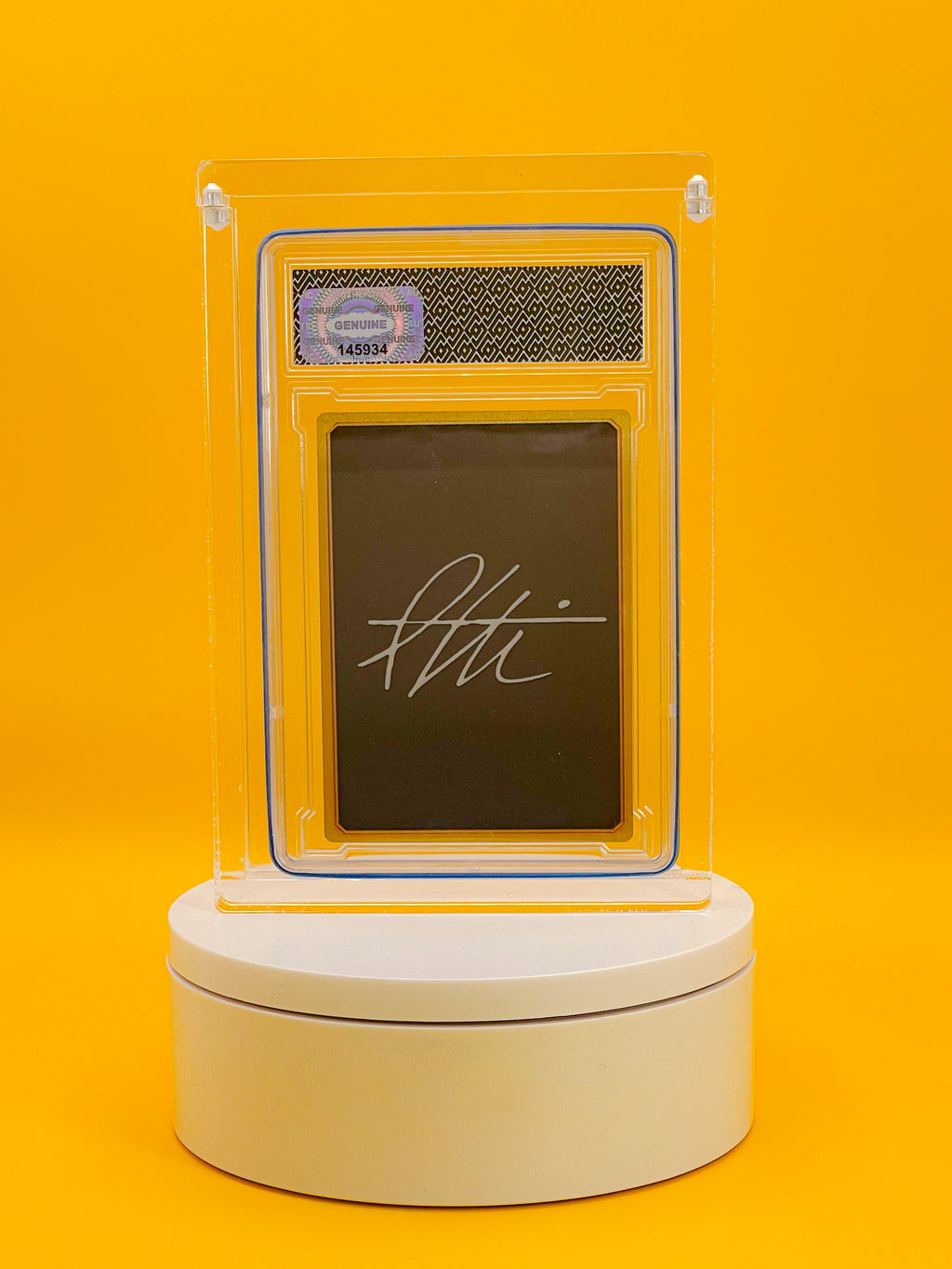 Decorative item with a clear acrylic cover on a yellow background