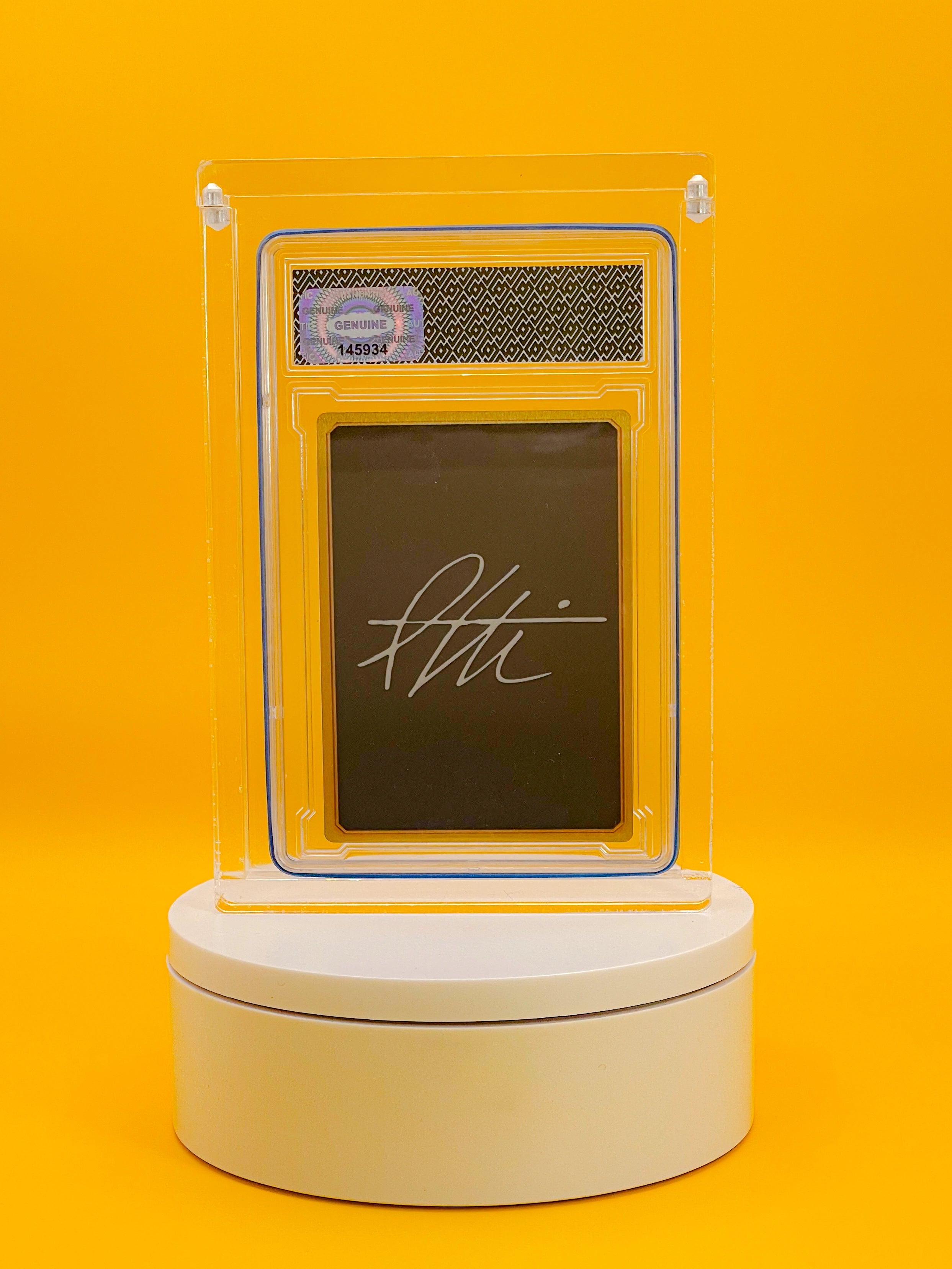 Decorative item with a clear acrylic cover on a yellow background