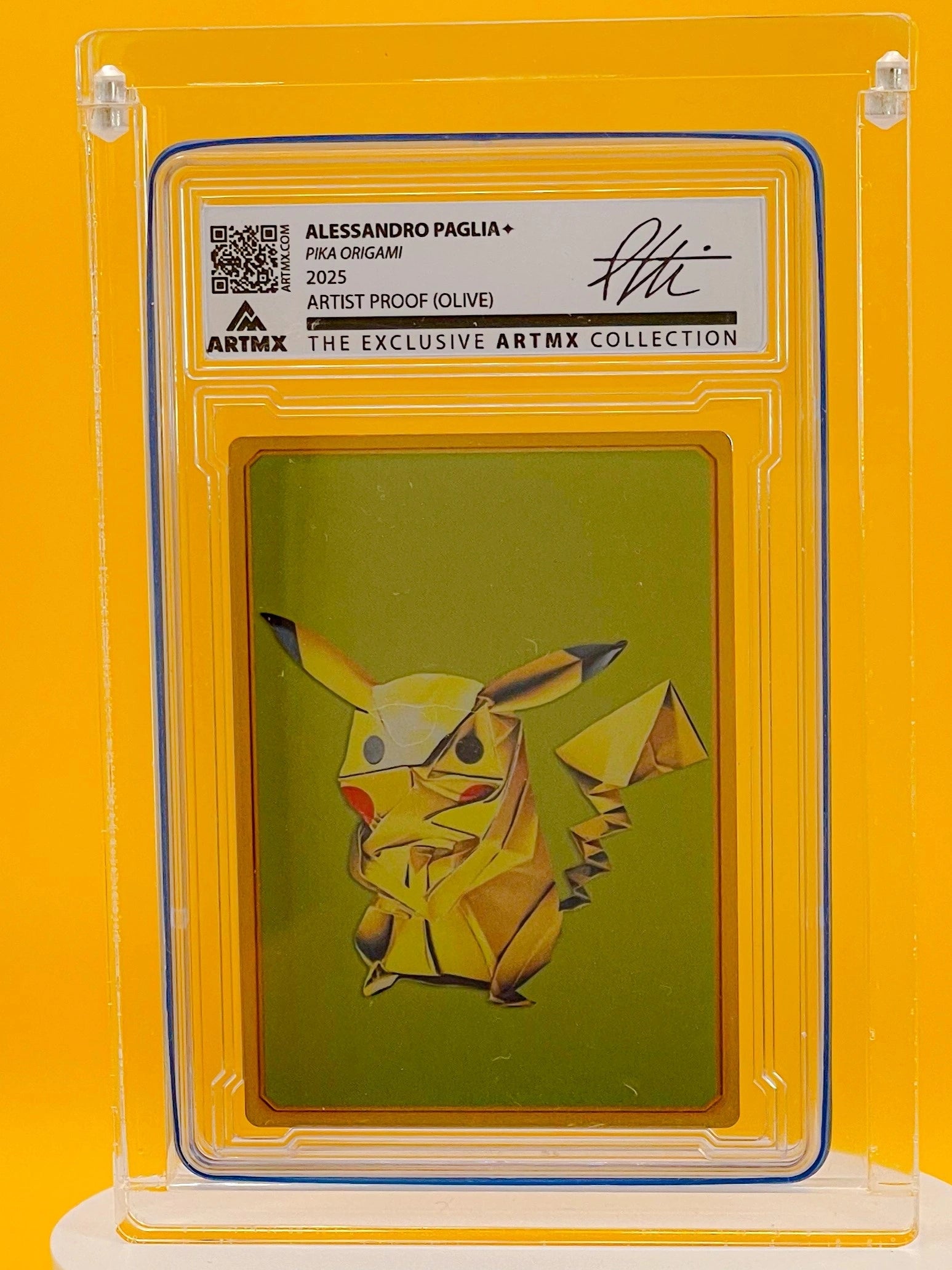 Origami Pikachu artwork in a protective frame with an artist's signature and label.