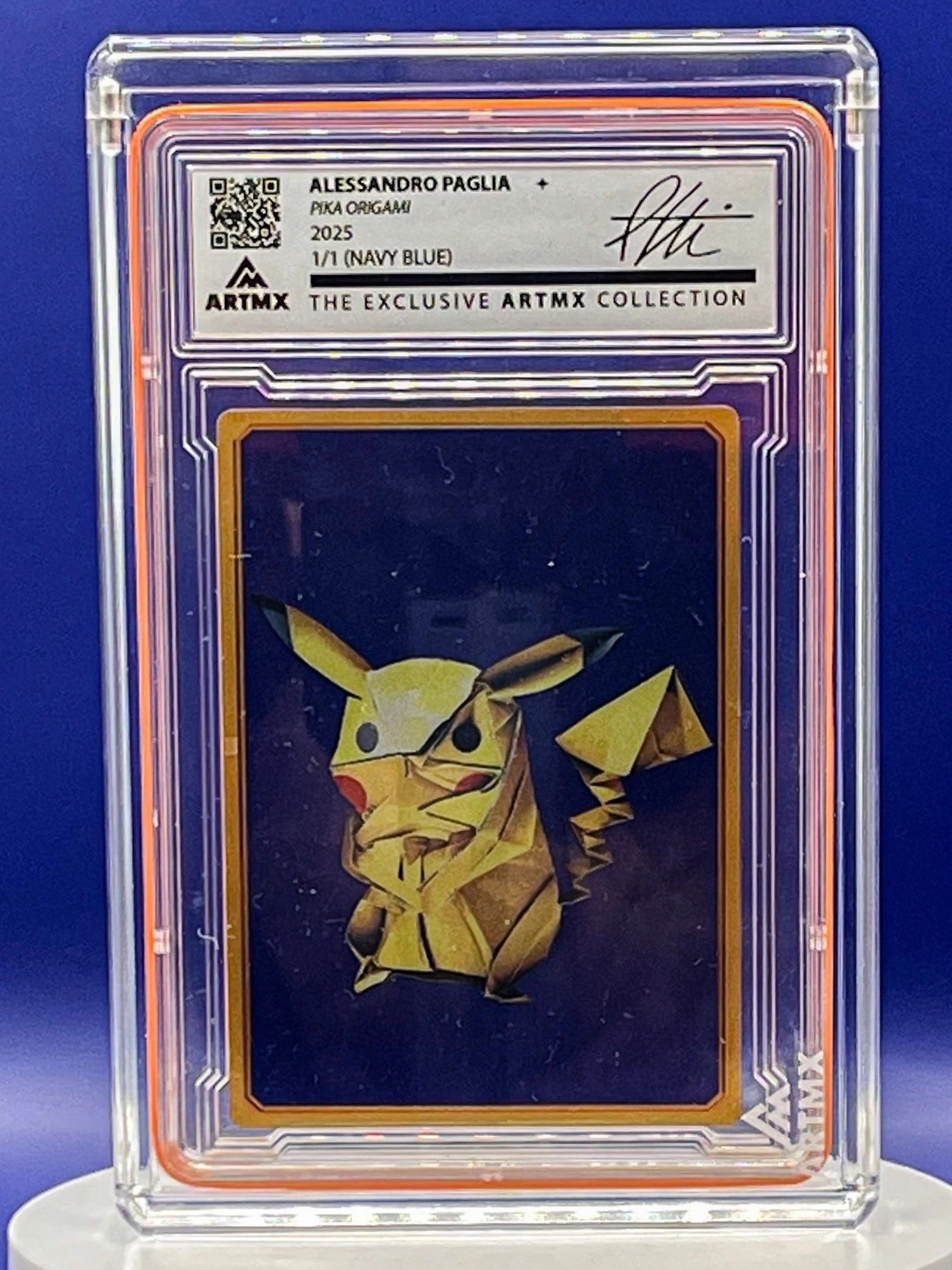 Origami Pikachu card in a protective case with Artmx branding