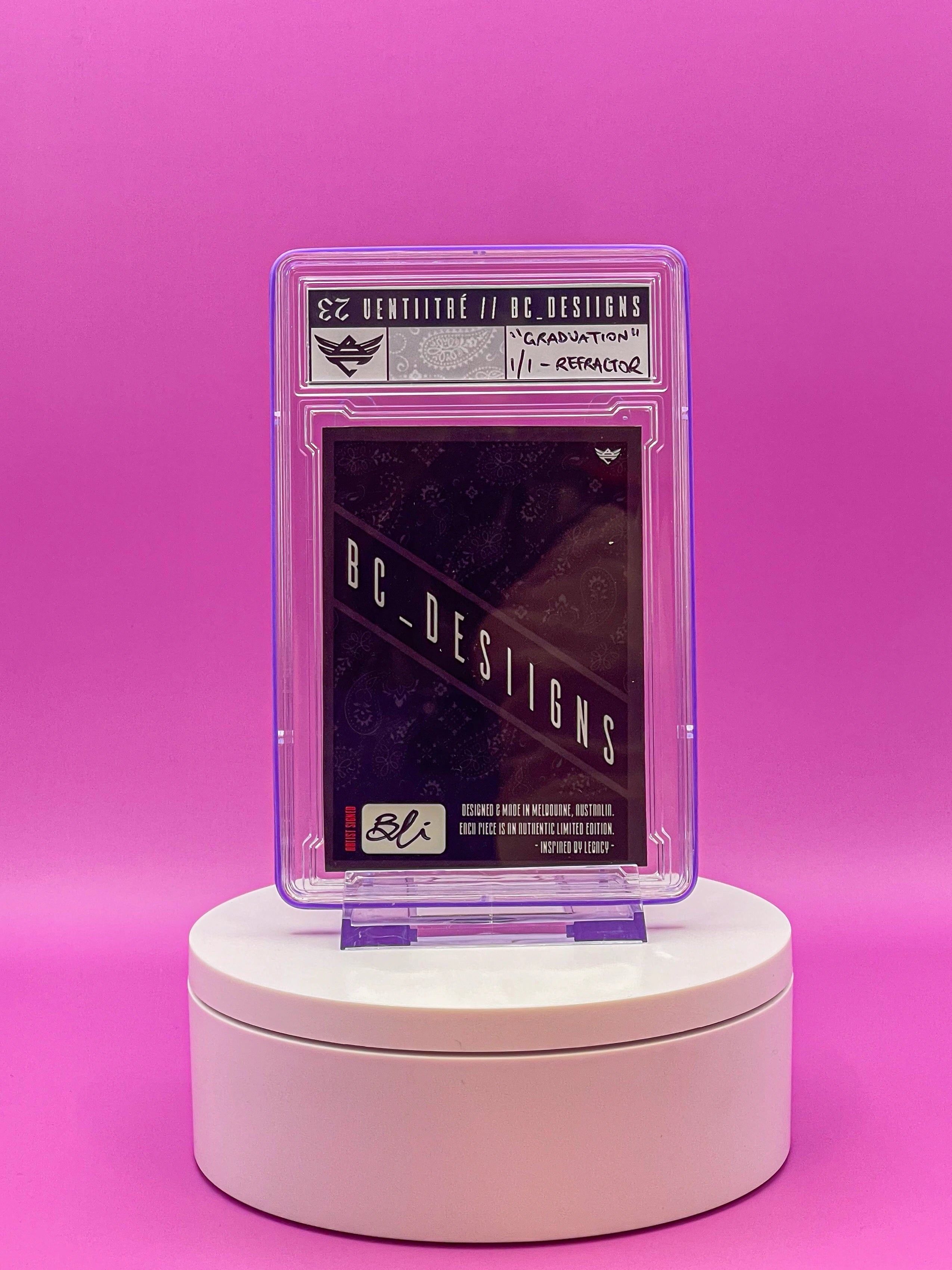 Card in a protective case on a white stand against a pink background