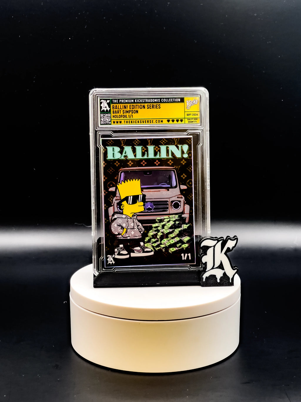 Trading card in protective case on a white stand with a black background