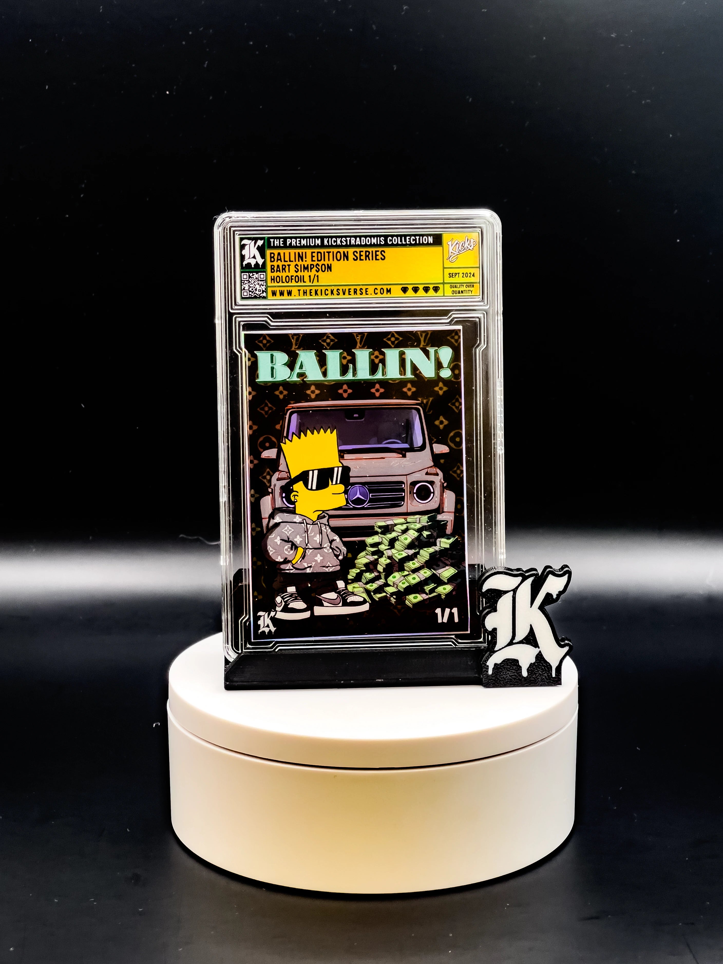 Trading card in protective case on a white stand with a black background