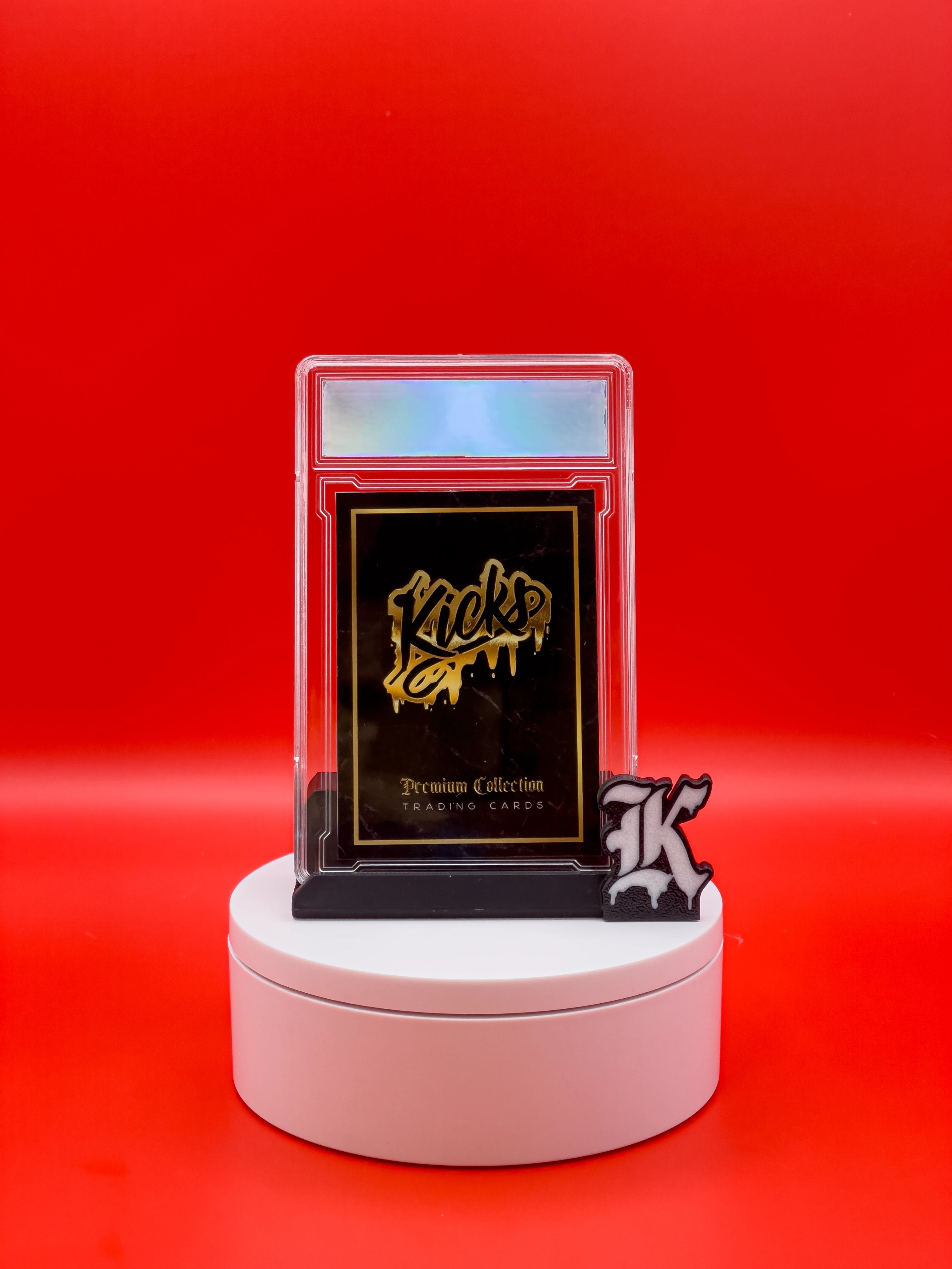 Collectible card on a stand with 'Kicks' branding against a red background