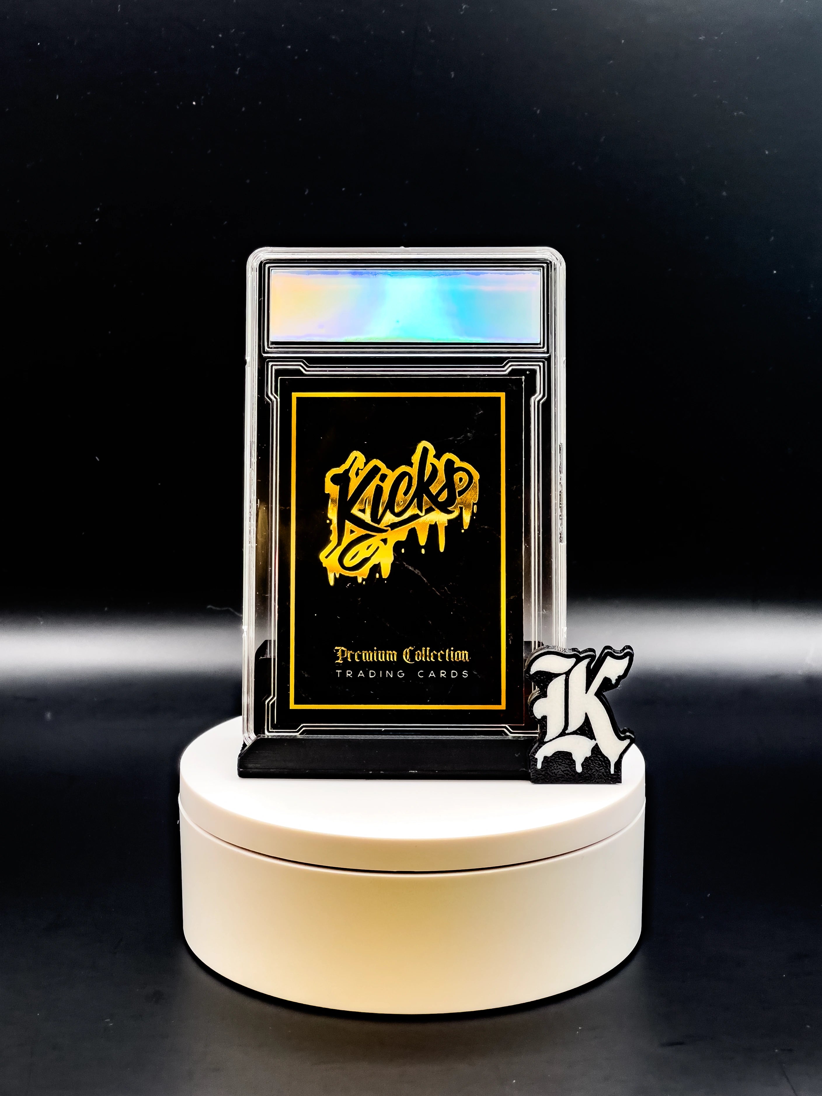 Trading card in a protective case on a white stand with a black background