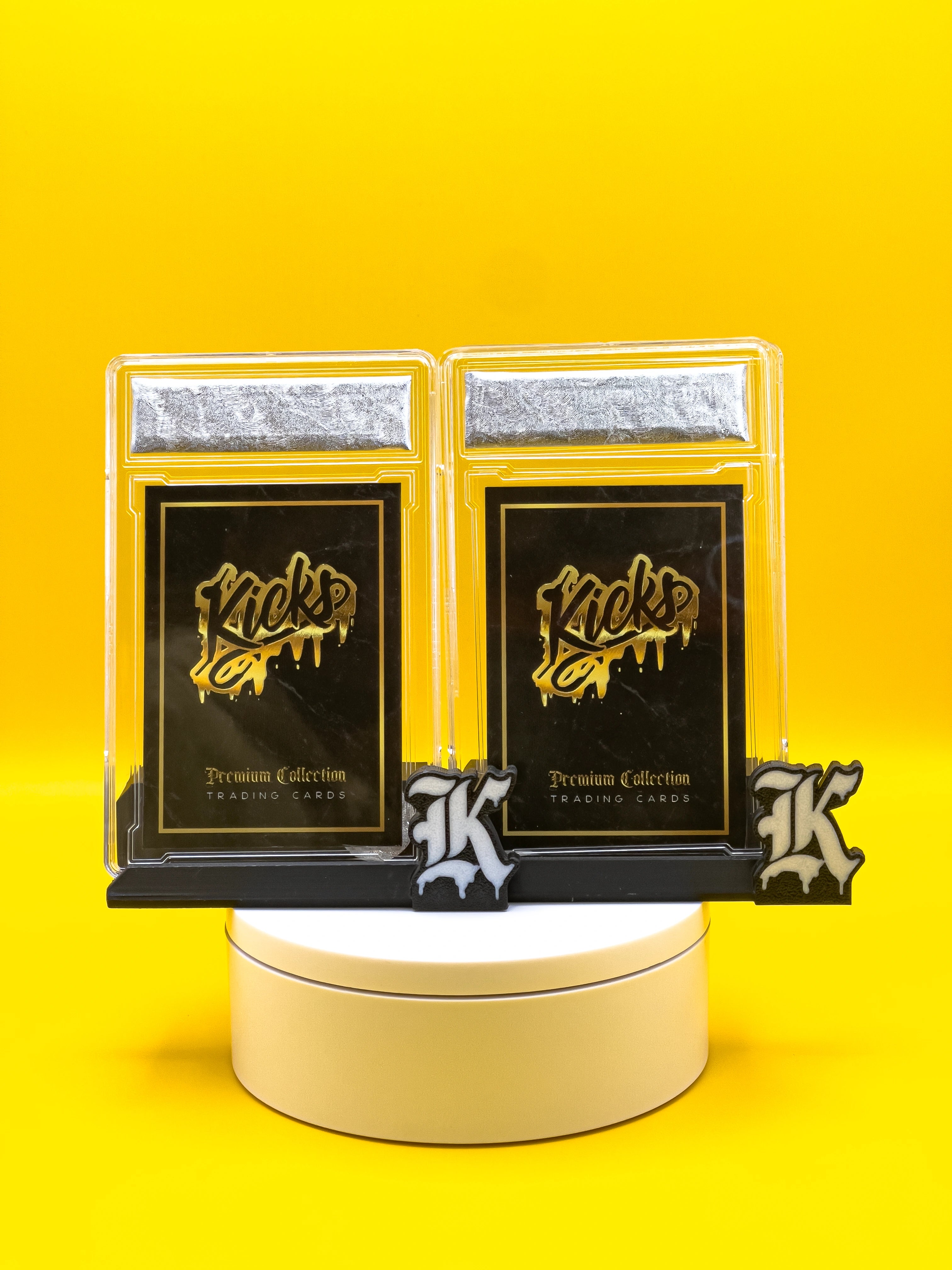 Two trading card with a logo on a yellow backgrounds 
