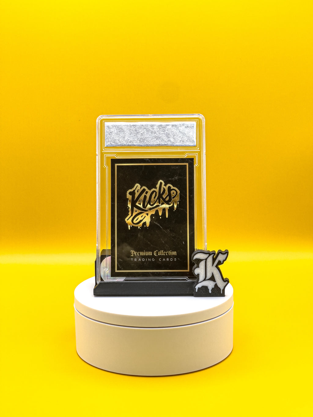 Trading card in a protective case on a yellow background